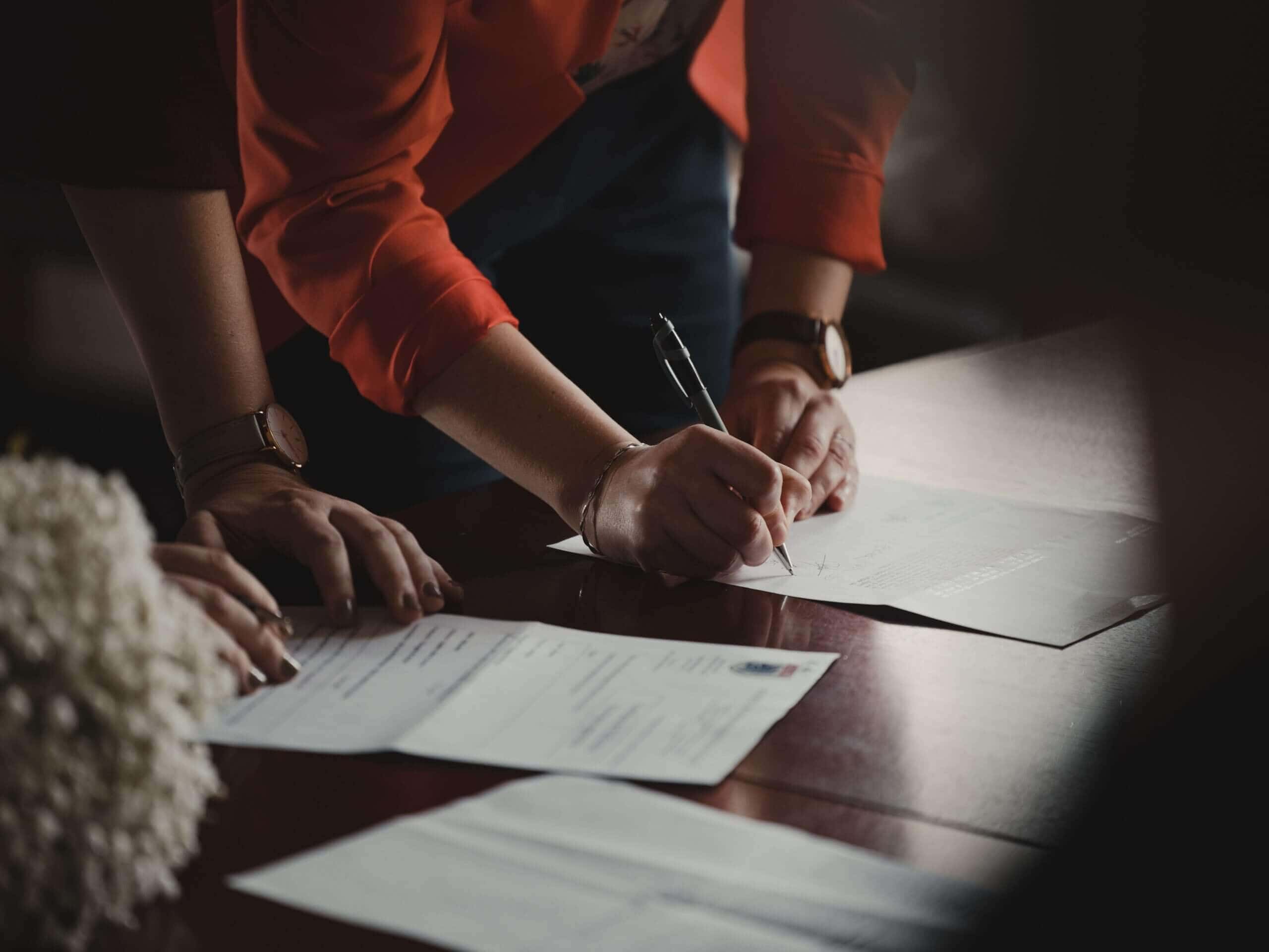 a person signing a contract